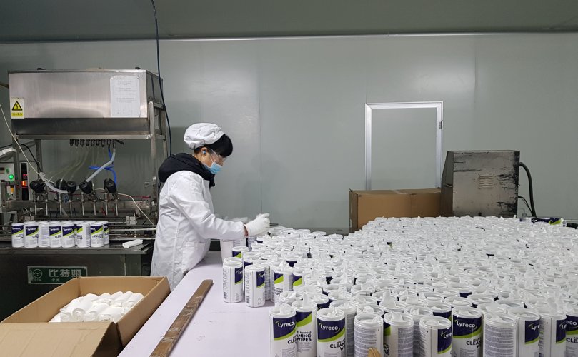 A worker is sorting Lyreco products