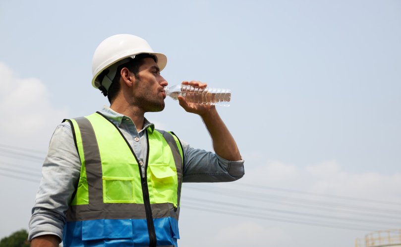 construction worker drinking water