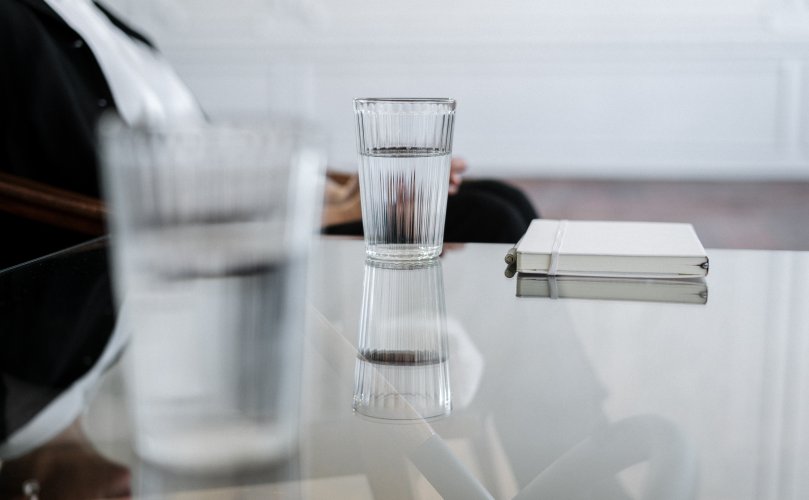 water in cup on office desk