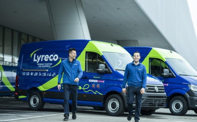 two man Lyreco courriers in front of lyreco vans